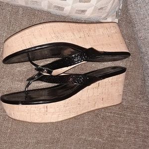 Black patent leather coach wedges